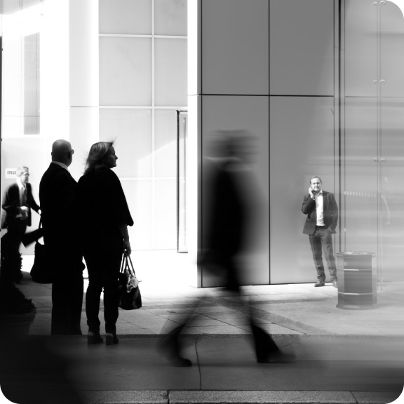 People in front of a modern office building